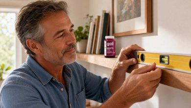CoQ10 benefits: a man in his fifties levelling a shelf with a spirit level