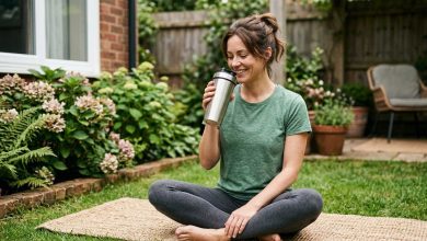 Woman relaxes outdoors with a drink, illustrating collagen gummies as part of a daily beauty routine.