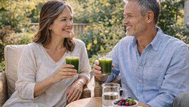 Two adults enjoy green matcha drinks outdoors, illustrating matcha caffeine content in a daily routine.